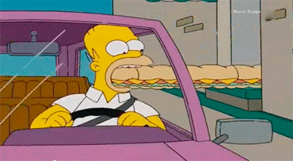 Гифка Гомер Симпсон ест прямо за рулём
