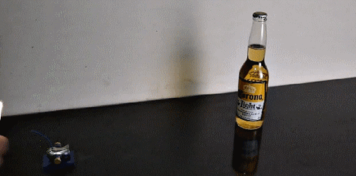 Гифка Микропушка стреляет в бутылку пива