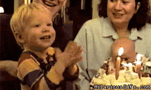 Гифка Мальчик пытается съесть свечку на день рождения