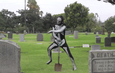 Гифка Скелет танцует на кладбище